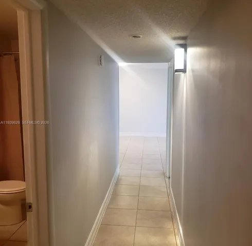 a view of a lake with houses in the back