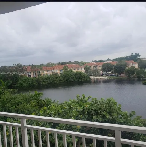 a white toilet sitting next to a bath tub