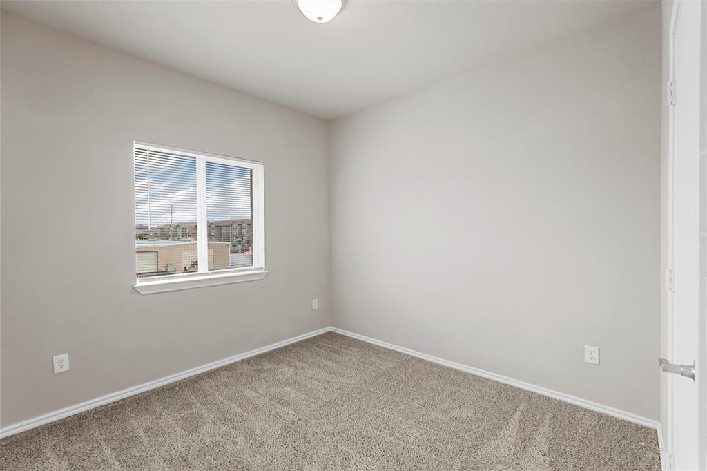 514 East Hazelwood Street, Unit A Princeton, TX 75407 - Photo 12 of 19 an empty room with a window