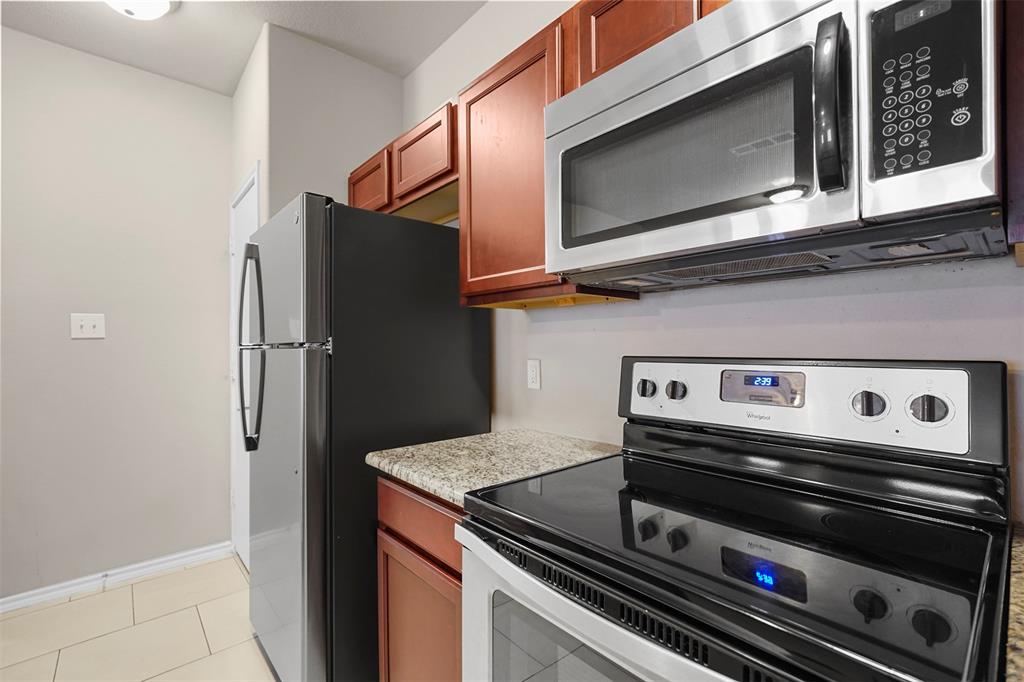 514 East Hazelwood Street, Unit A Princeton, TX 75407 - Photo 5 of 19 a stove top oven sitting inside of a kitchen