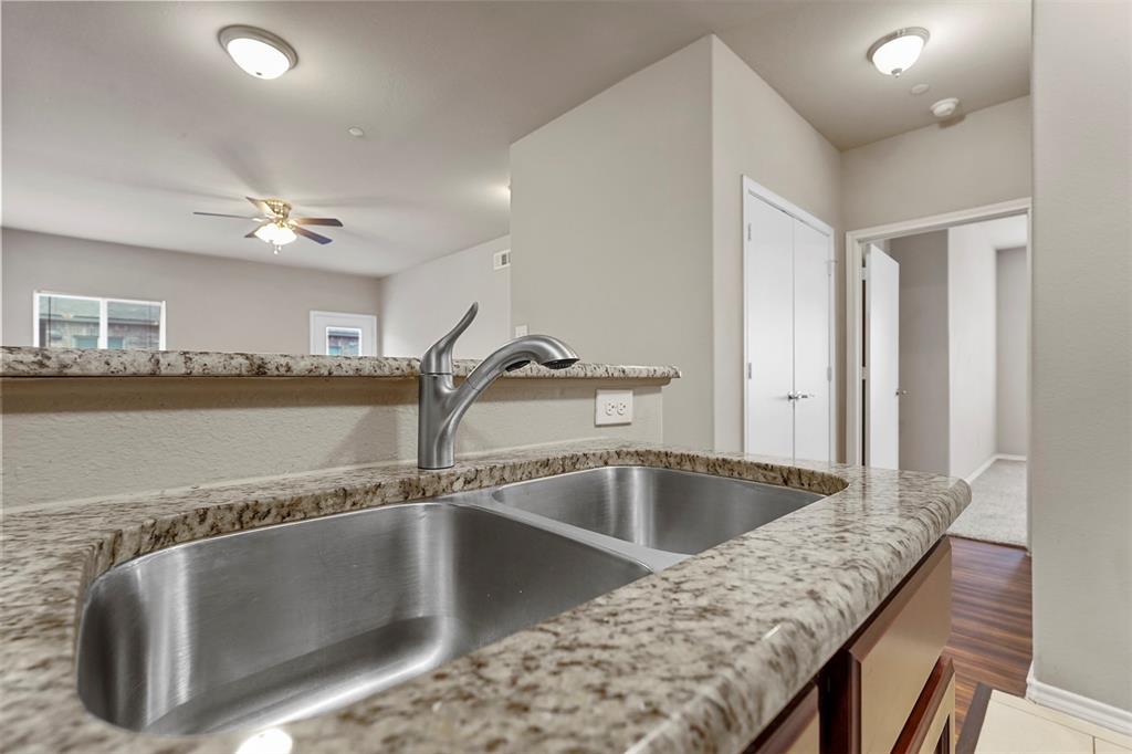 514 East Hazelwood Street, Unit A Princeton, TX 75407 - Photo 6 of 19 a view of a kitchen counter space a sink and dishwasher