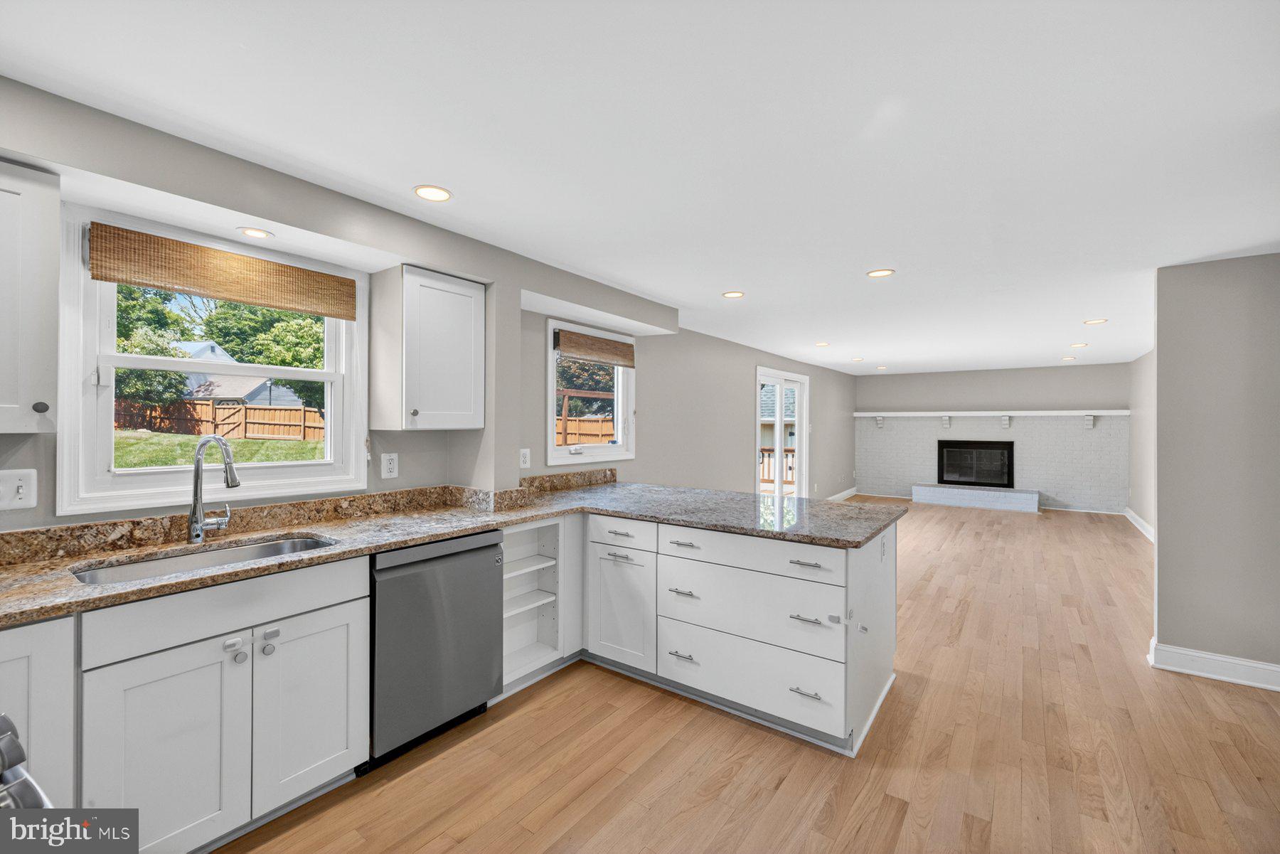 7518 Candytuft Court Springfield, VA 22153 - Photo 11 of 47 a kitchen with a sink stove and cabinets