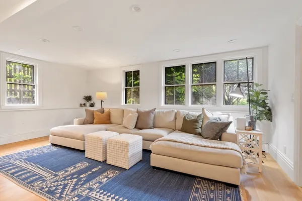 a living room with furniture and windows