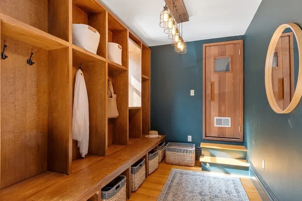 a bathroom with a sink a mirror and a shower