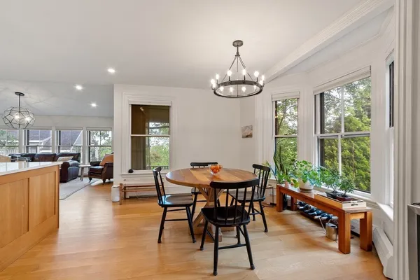 a view of a dining room with furniture window and outside view