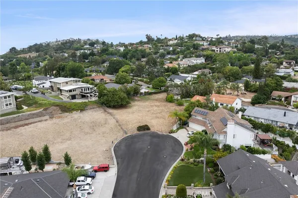 an aerial view of a house with a garden