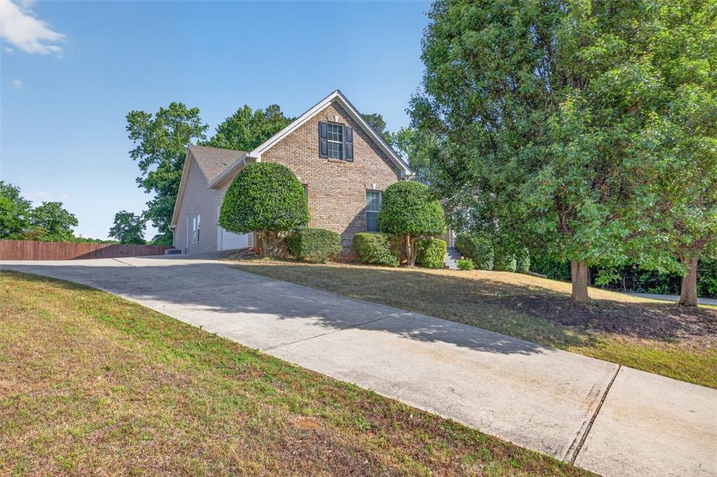 89 Katie Spring Lane Jefferson, GA 30549 - Photo 6 of 63 a view of a house with a yard and pathway