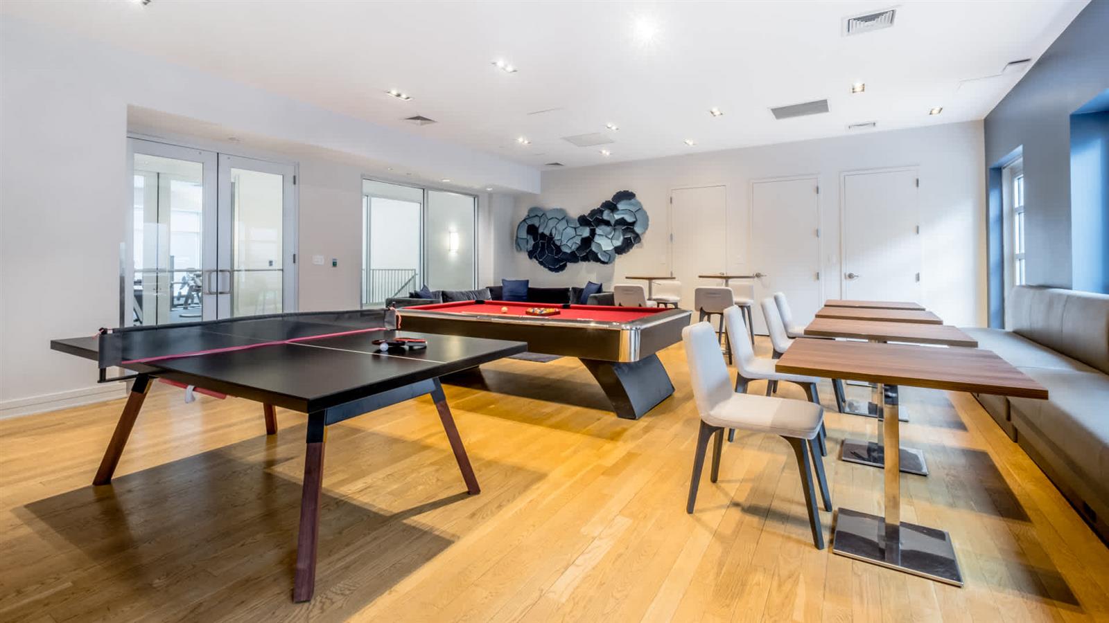 175 Kent Avenue, Unit 403 Brooklyn, NY 11249 - Photo 6 of 9 a room with a table and chairs