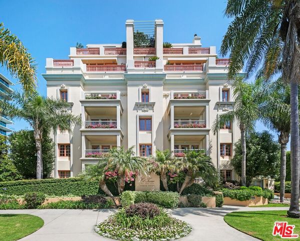 front view of a building with a garden