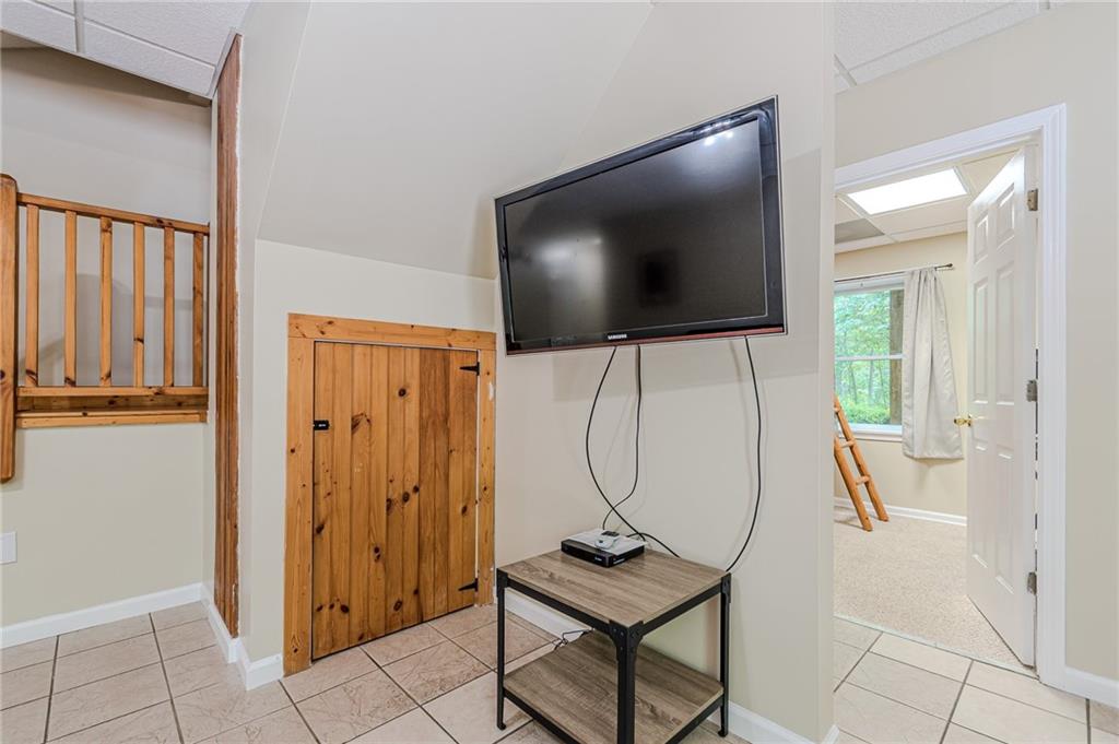 45 Chestatee River Ridge Dahlonega, GA 30533 - Photo 13 of 74 a living room with furniture and a flat screen tv