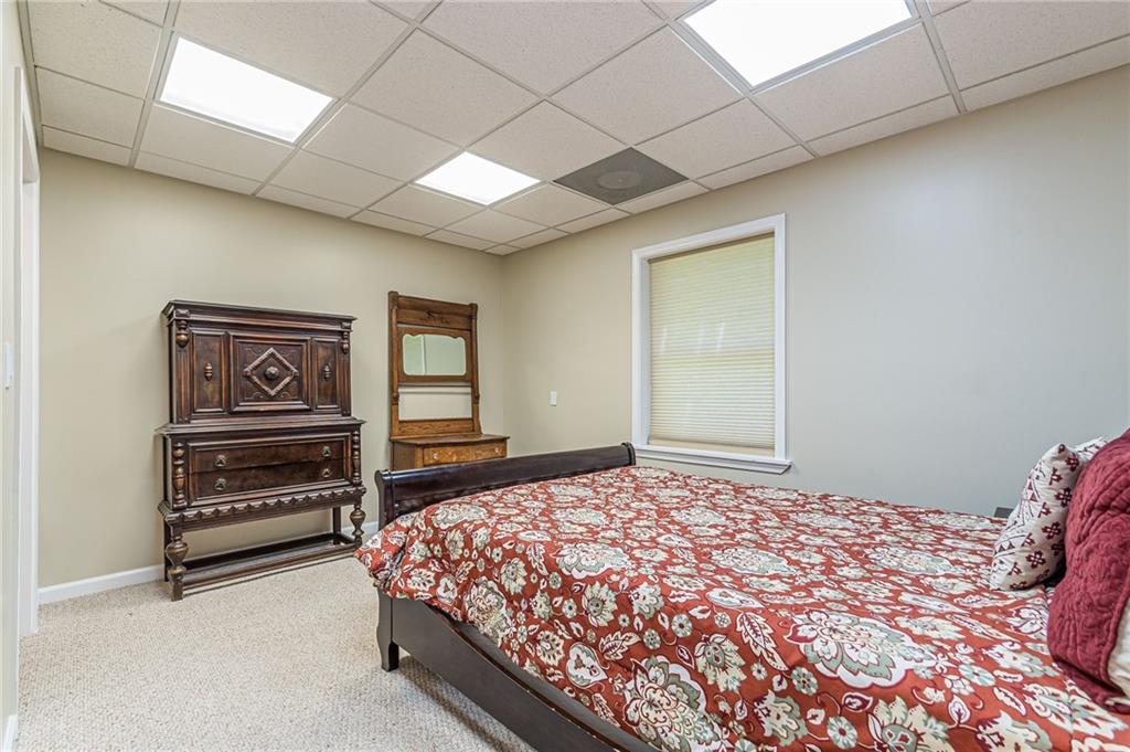 45 Chestatee River Ridge Dahlonega, GA 30533 - Photo 17 of 74 a bedroom with a bed and a dresser