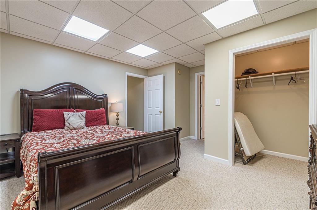 45 Chestatee River Ridge Dahlonega, GA 30533 - Photo 19 of 74 a bedroom with a bed and a dresser