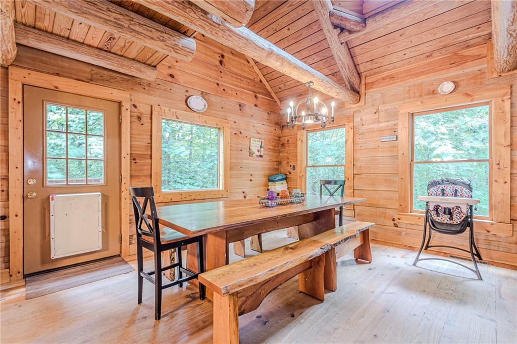 45 Chestatee River Ridge Dahlonega, GA 30533 - Photo 30 of 74 a room with furniture on wooden floor and windows