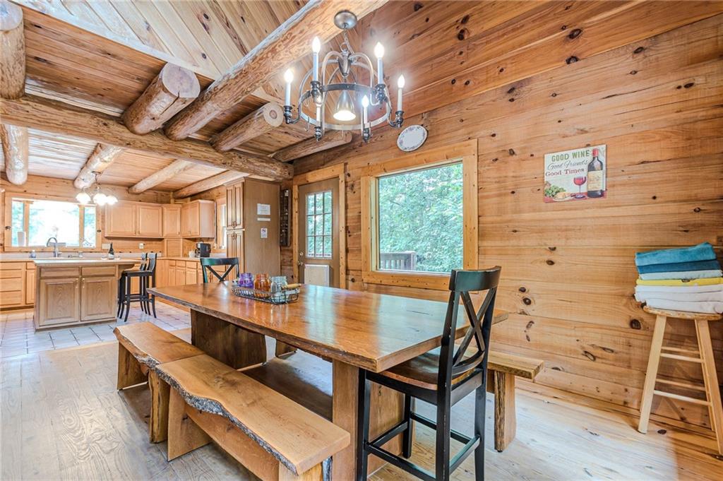 45 Chestatee River Ridge Dahlonega, GA 30533 - Photo 33 of 74 a view of a dining room with furniture a chandelier and wooden floor