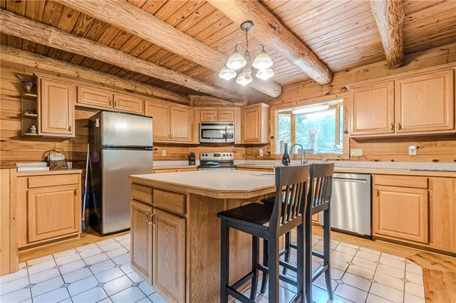 a bathroom with a granite countertop sink and a window