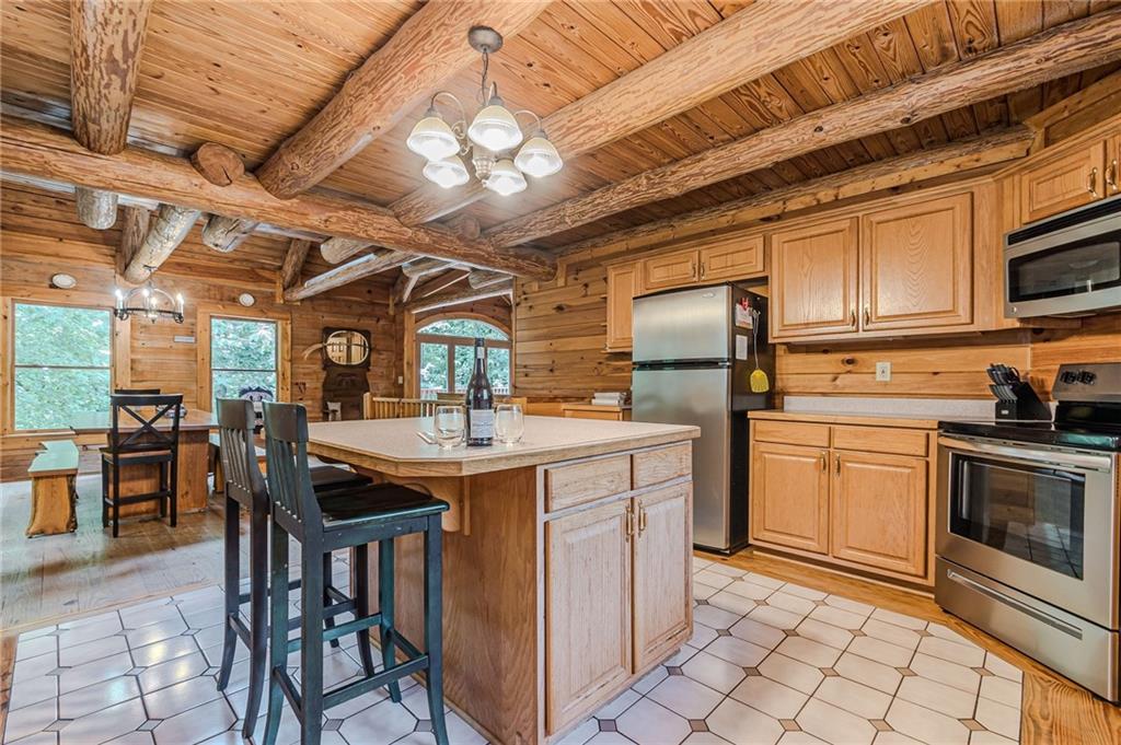 45 Chestatee River Ridge Dahlonega, GA 30533 - Photo 37 of 74 a kitchen with stainless steel appliances granite countertop a sink a stove and cabinets