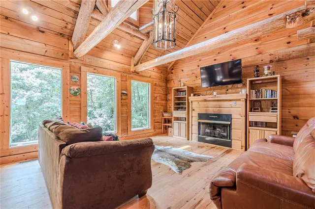 a bed sitting in a bedroom next to a lamp