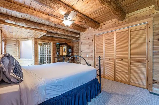 a view of table and chairs under an umbrella
