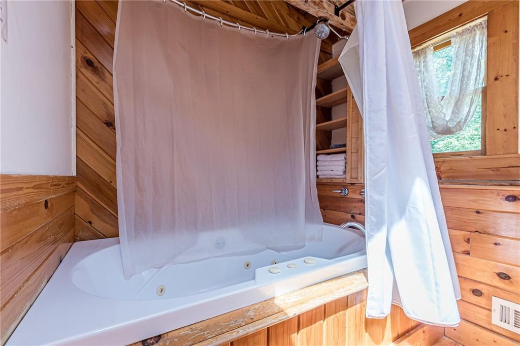 45 Chestatee River Ridge Dahlonega, GA 30533 - Photo 59 of 74 a bathroom with a bathtub and shower