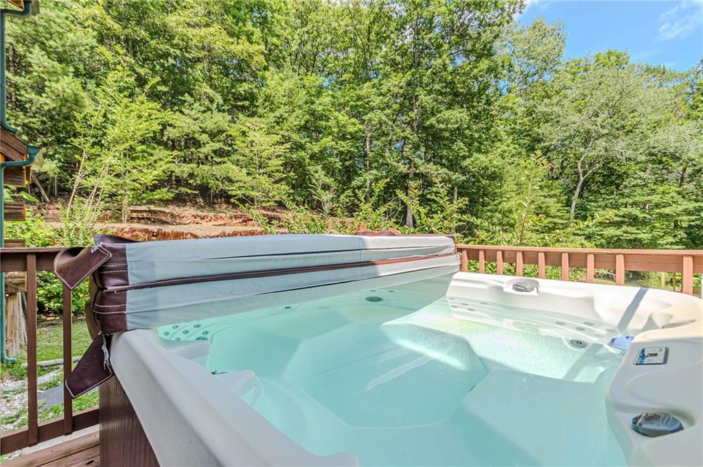 45 Chestatee River Ridge Dahlonega, GA 30533 - Photo 66 of 74 a roof deck with couches and wooden fence