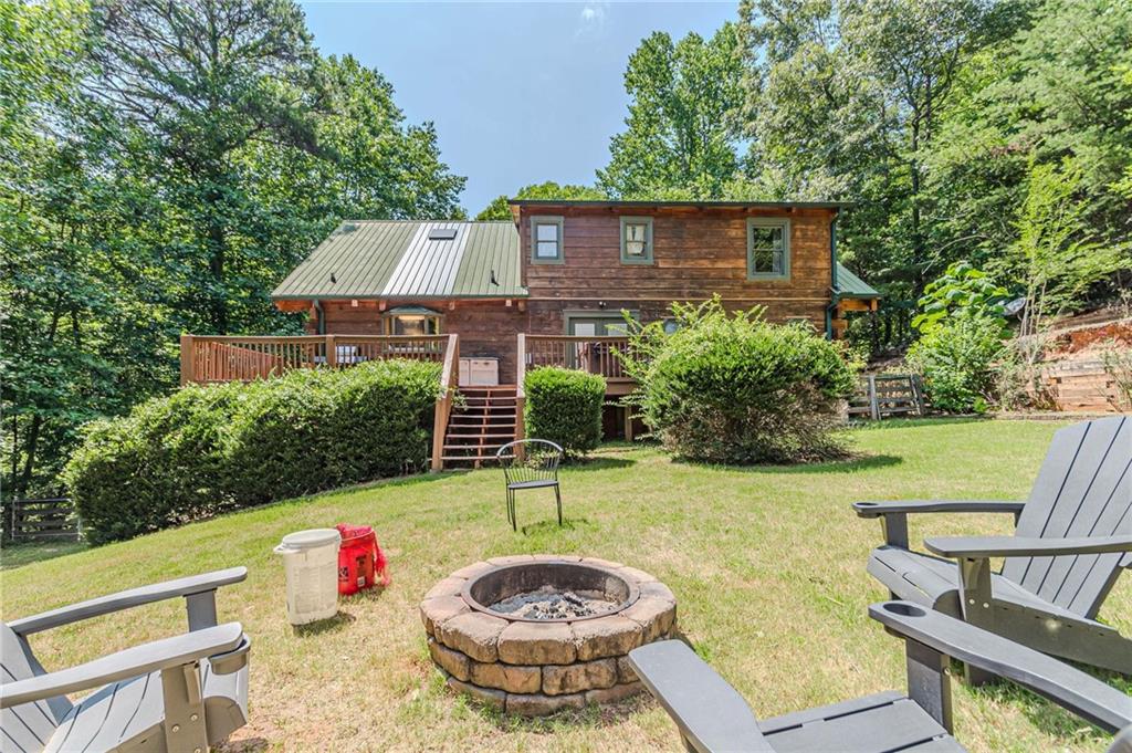 45 Chestatee River Ridge Dahlonega, GA 30533 - Photo 70 of 74 a view of a chairs and table in backyard