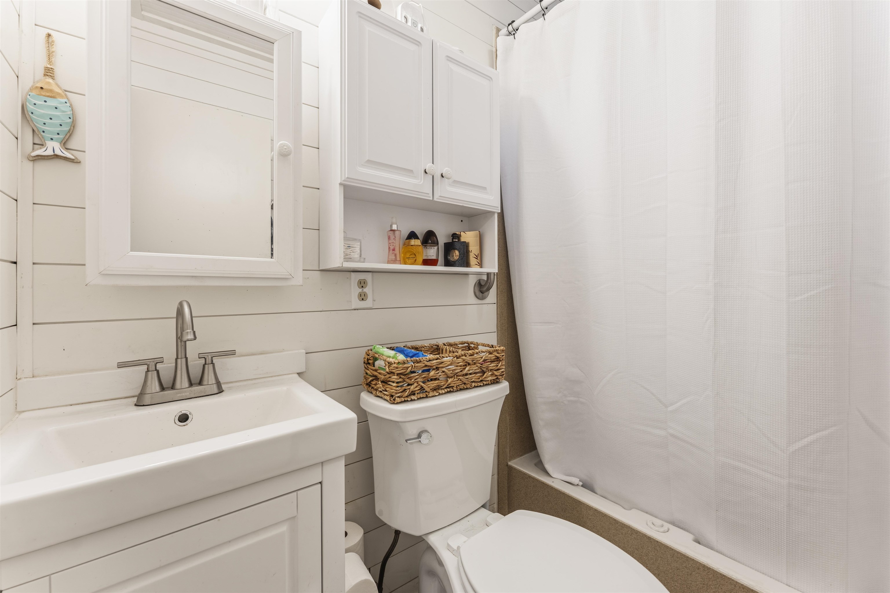 5271 Princeton Road Memphis, TN 38120 - Photo 17 of 30 Compact bathroom featuring white shiplap walls