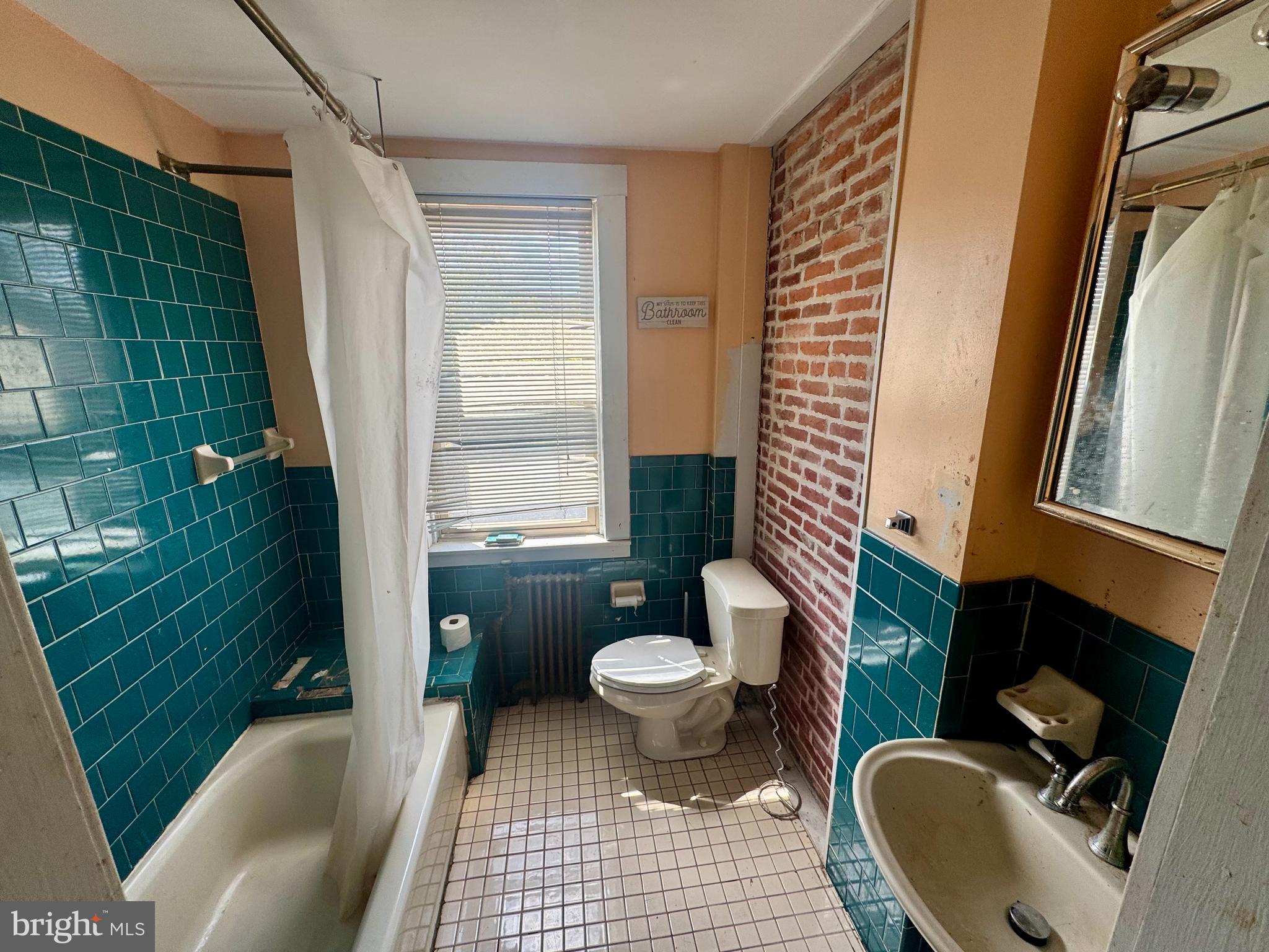 3301 Foster Avenue Baltimore, MD 21224 - Photo 12 of 19 a bathroom with a sink toilet and shower