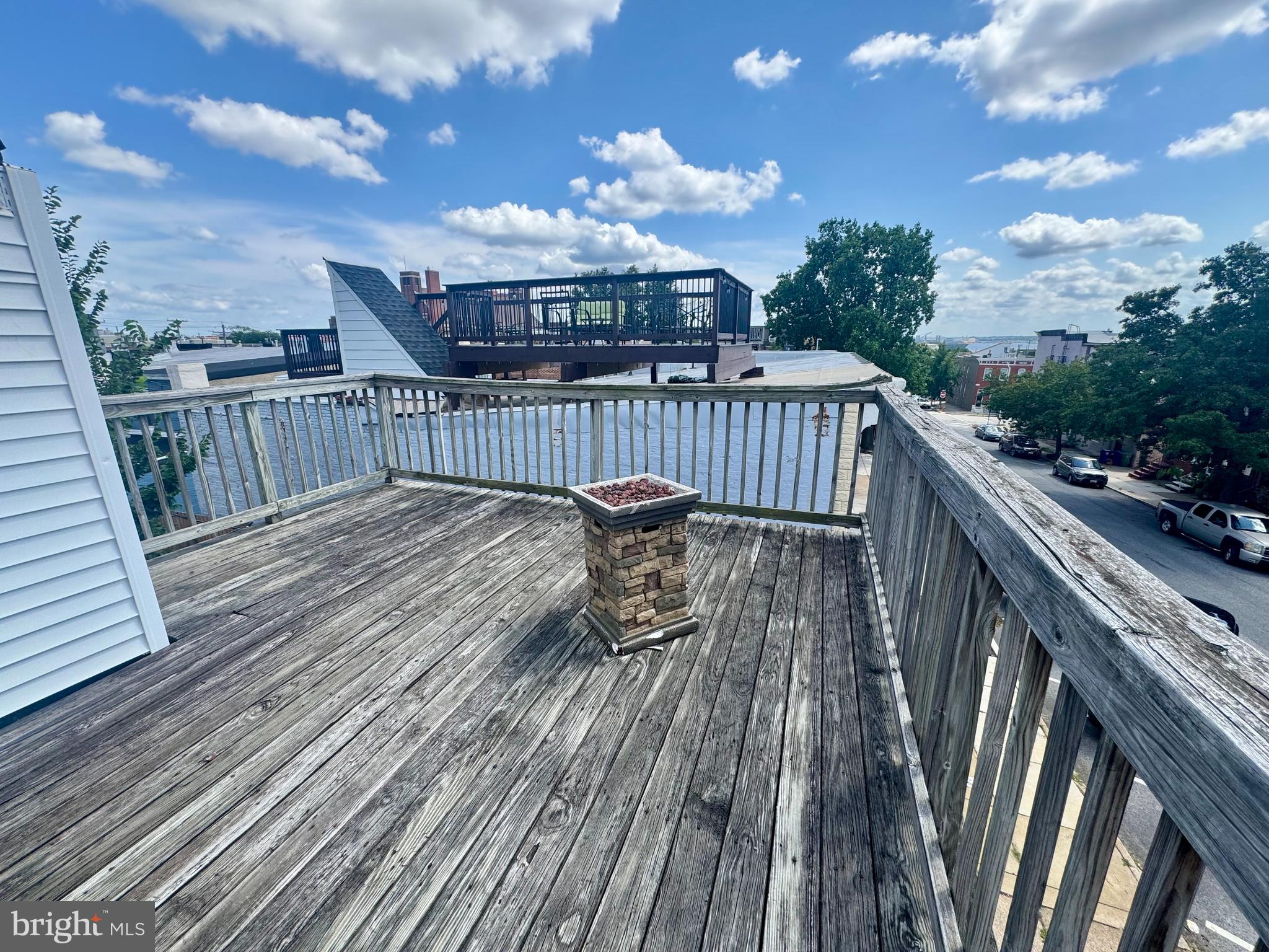 3301 Foster Avenue Baltimore, MD 21224 - Photo 15 of 19 a view of balcony with deck wooden floor and outdoor seating