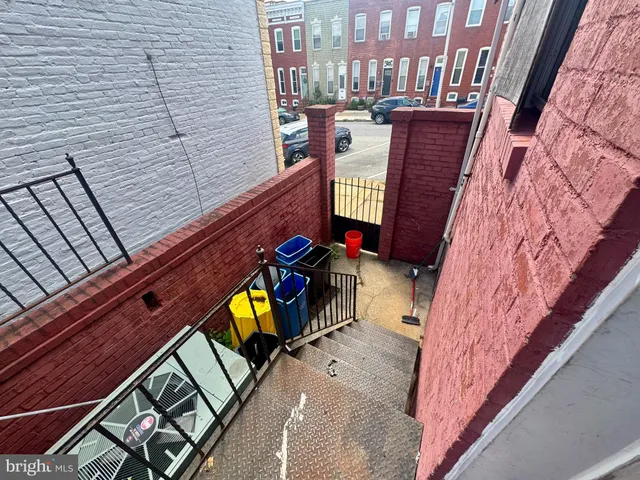 a view of a brick building with many windows