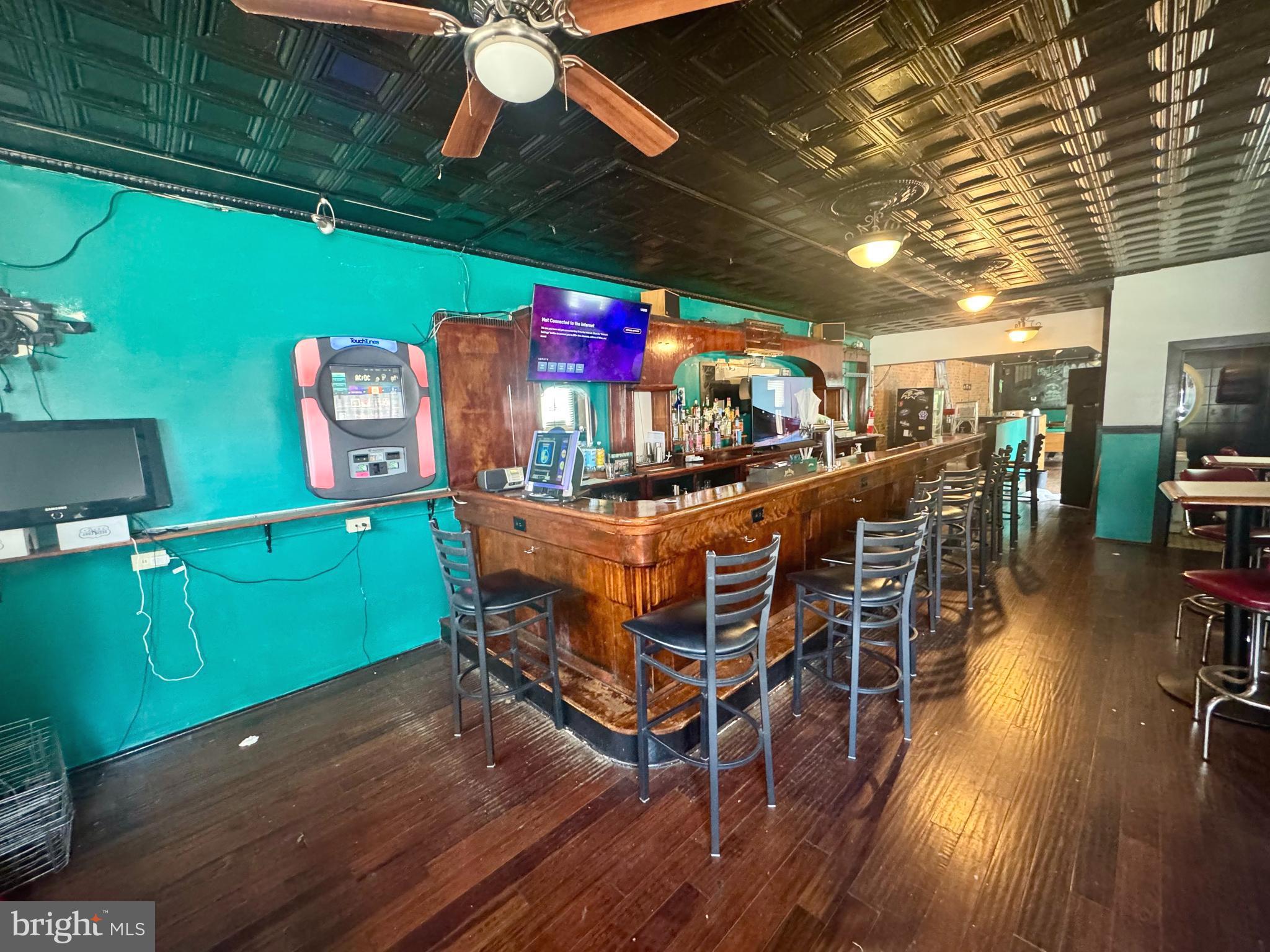 3301 Foster Avenue Baltimore, MD 21224 - Photo 5 of 19 a dining room with furniture and wooden floor