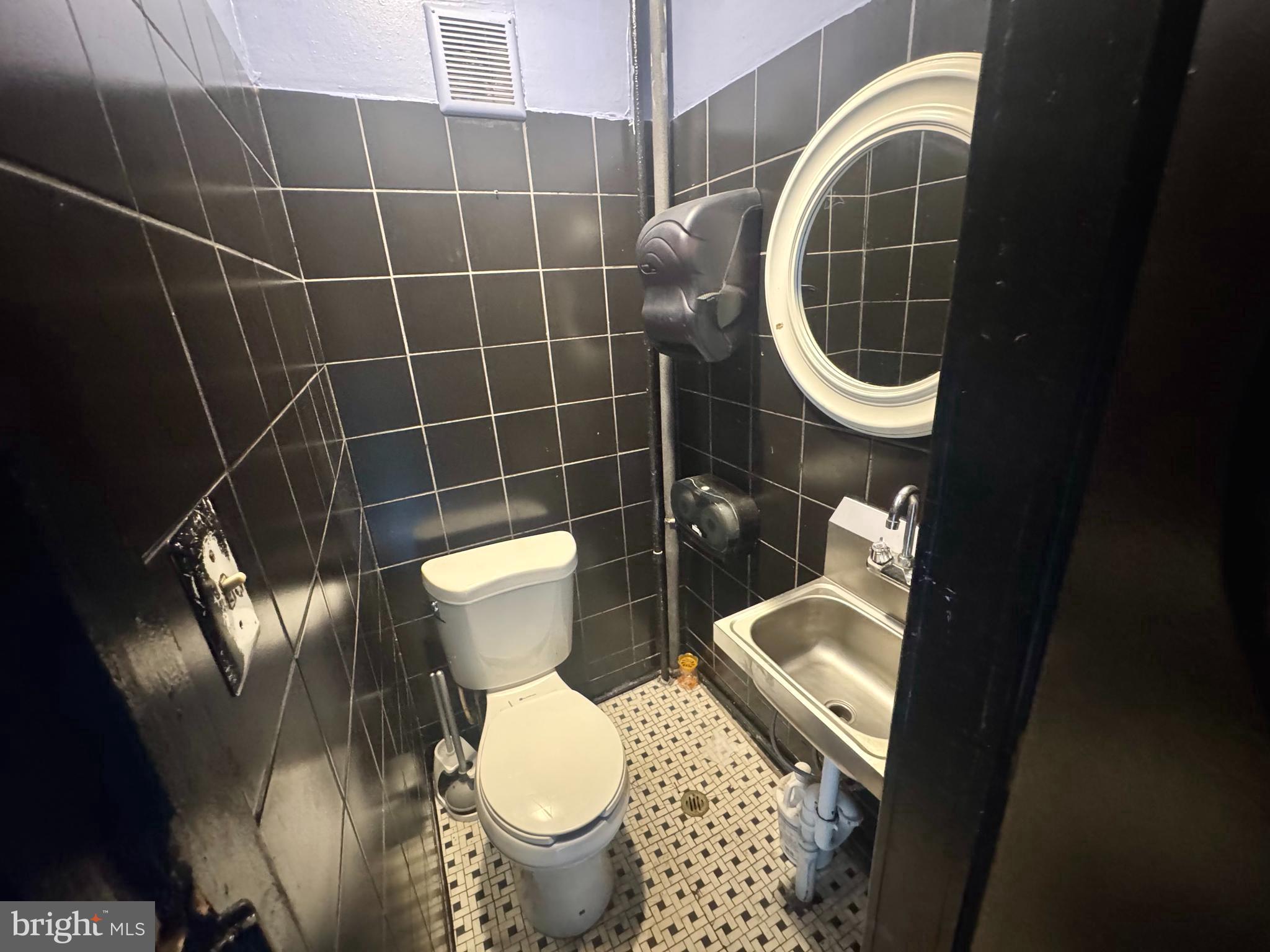 3301 Foster Avenue Baltimore, MD 21224 - Photo 8 of 19 a bathroom with a toilet and a sink