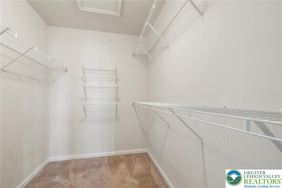 8455 Starling Road Breinigsville, PA 18031 - Photo 16 of 24 Ample shelving in this walk-in closet provides practical storage solutions for any wardrobe.