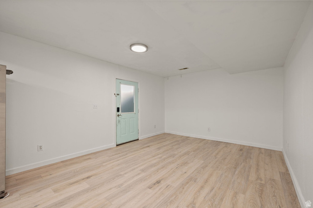 594 850 West Provo, UT 84601 - Photo 24 of 33 Spacious room featuring light wood-finish flooring, white walls, and a recessed ceiling light