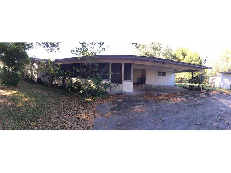 1012 North Combee Road Lakeland, FL 33801 - Photo 1 of 1 a black and white photo of a house