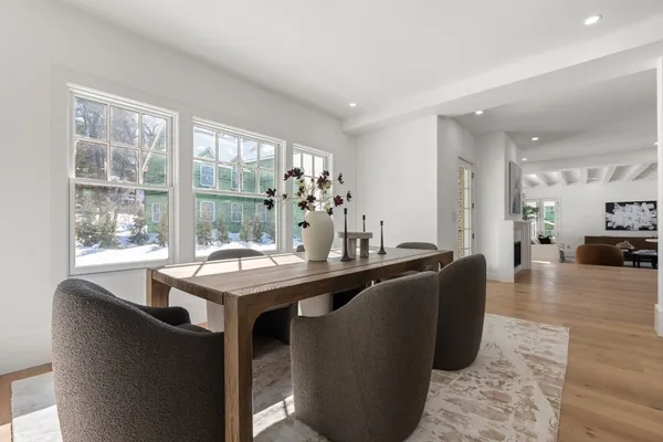 a dining room with a table and chairs