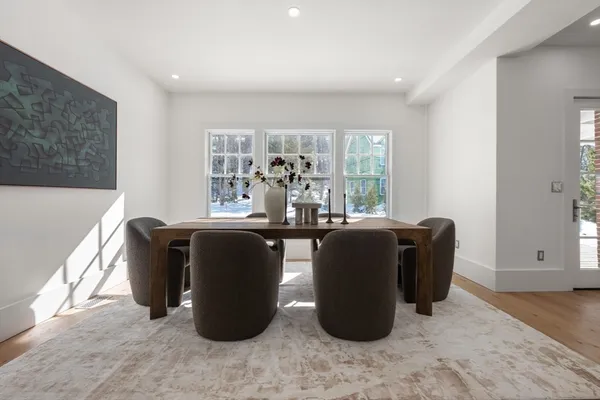 a living room with furniture and windows