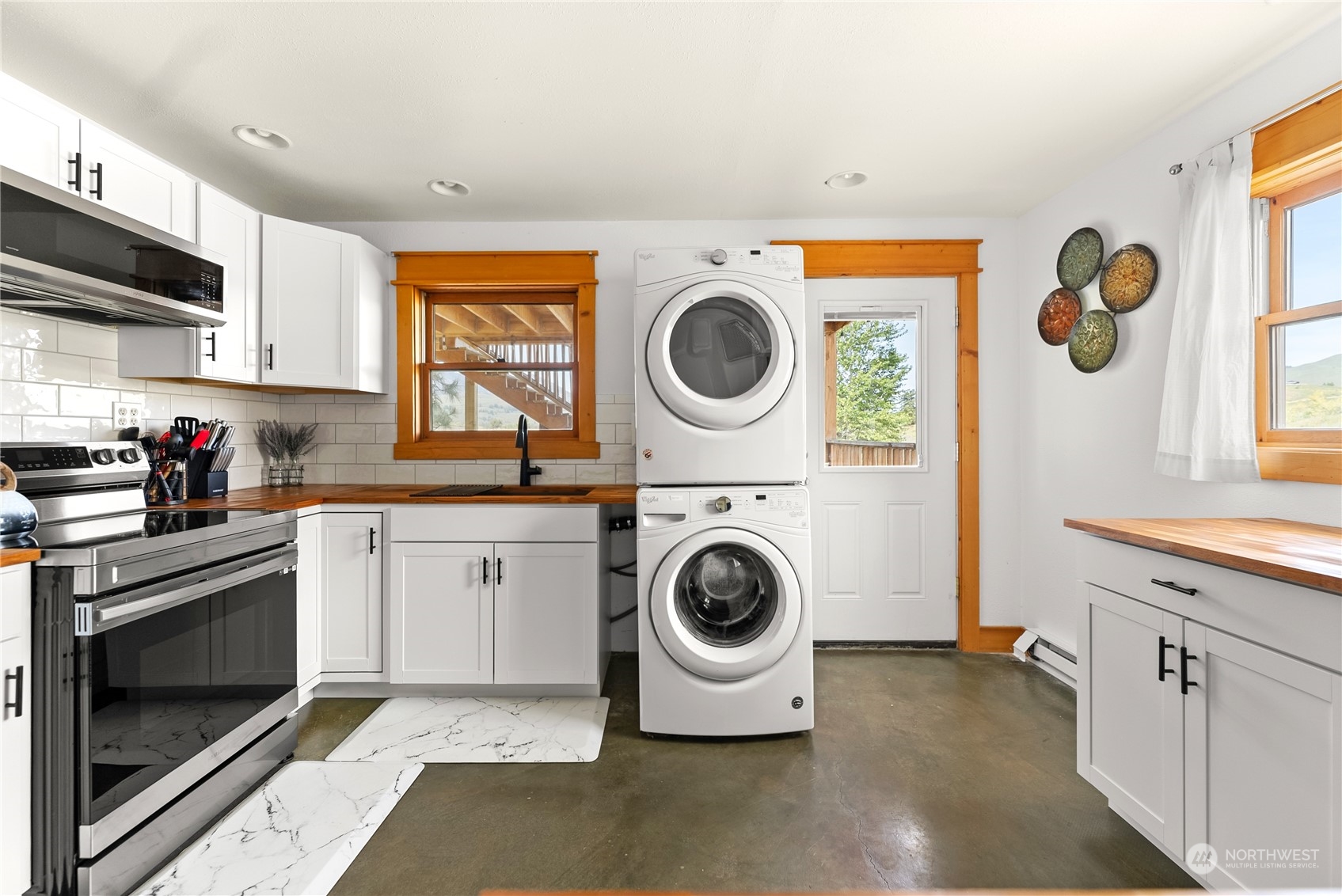 33 West Chewuch Road Winthrop, WA 98862 - Photo 15 of 33 a kitchen with a stove top oven sink and cabinets
