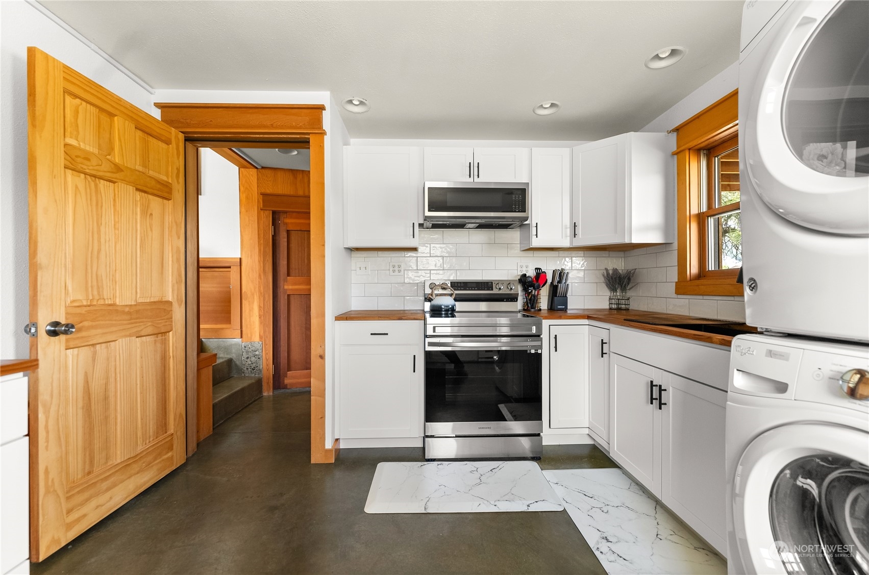 33 West Chewuch Road Winthrop, WA 98862 - Photo 16 of 33 a kitchen with stainless steel appliances granite countertop a stove a sink and a refrigerator