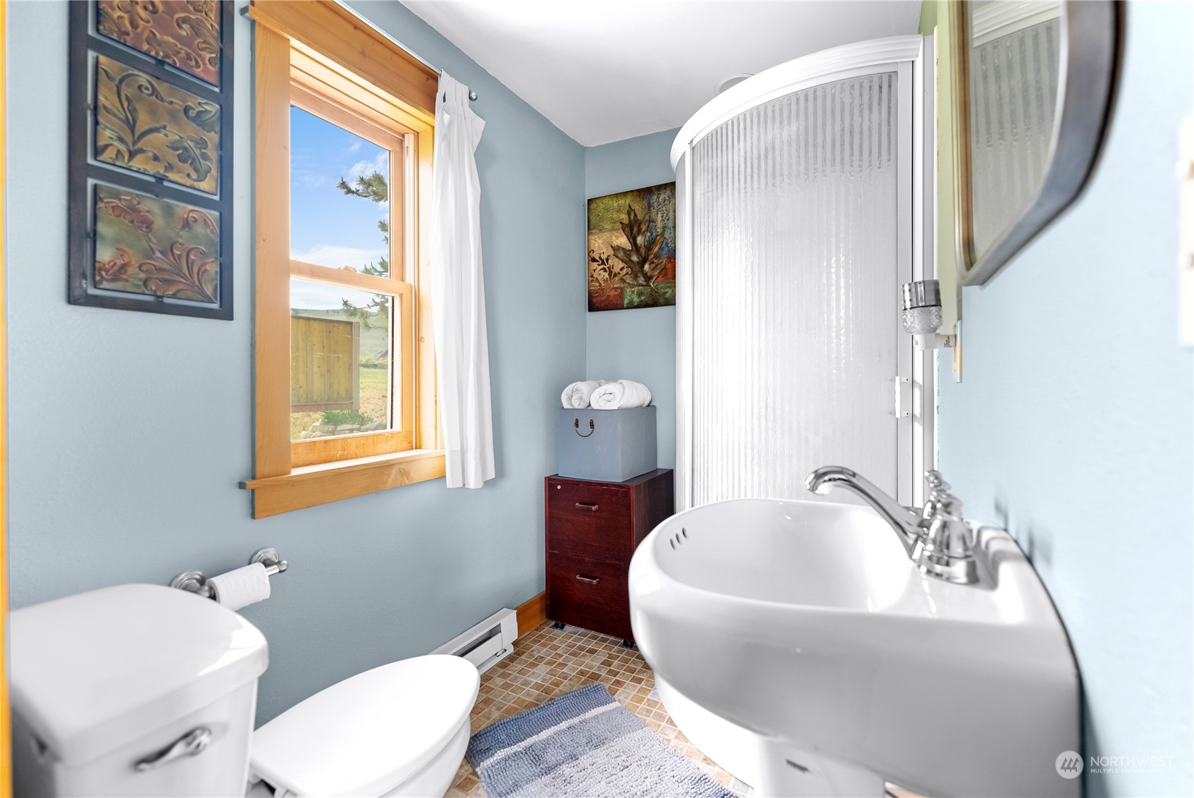 33 West Chewuch Road Winthrop, WA 98862 - Photo 19 of 33 a spacious bathroom with a toilet a sink and a mirror