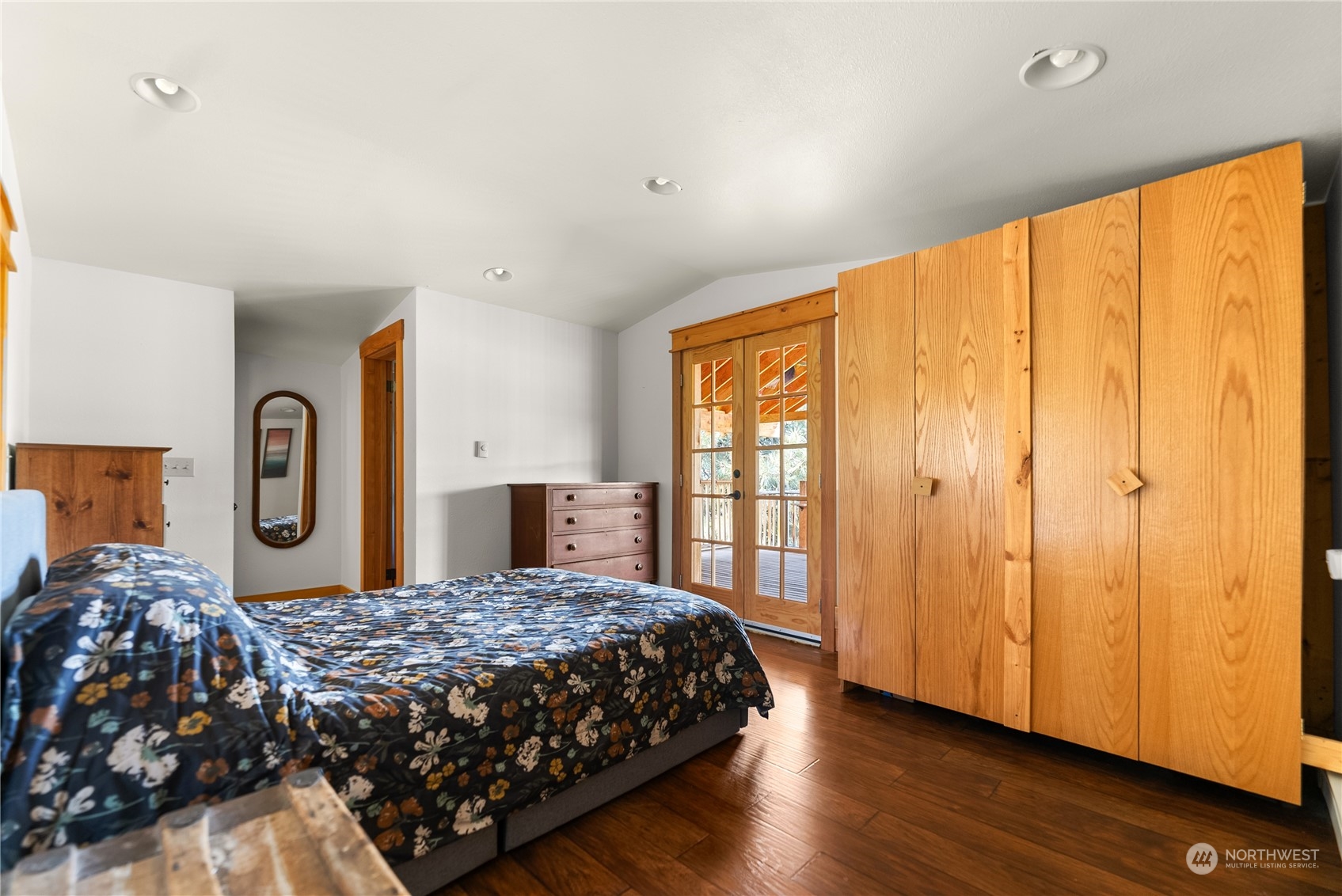 33 West Chewuch Road Winthrop, WA 98862 - Photo 22 of 33 a bedroom with a large bed and wooden floor