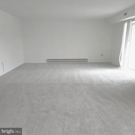 a view of a room with an empty space