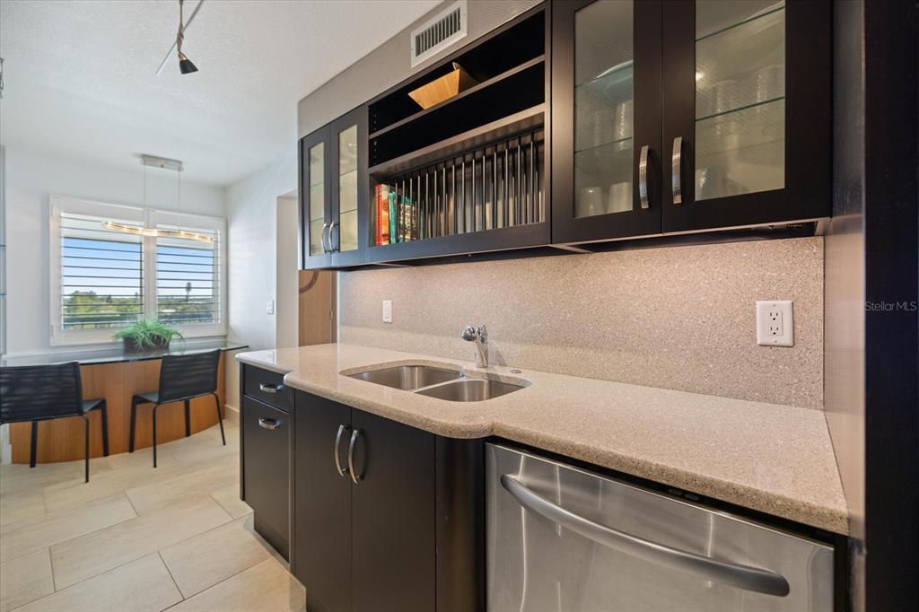 625 Beach Road, Unit 602 Sarasota, FL 34242 - Photo 13 of 65 a kitchen with stainless steel appliances a sink and cabinets