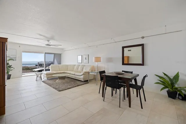 a bedroom with a bed and large window