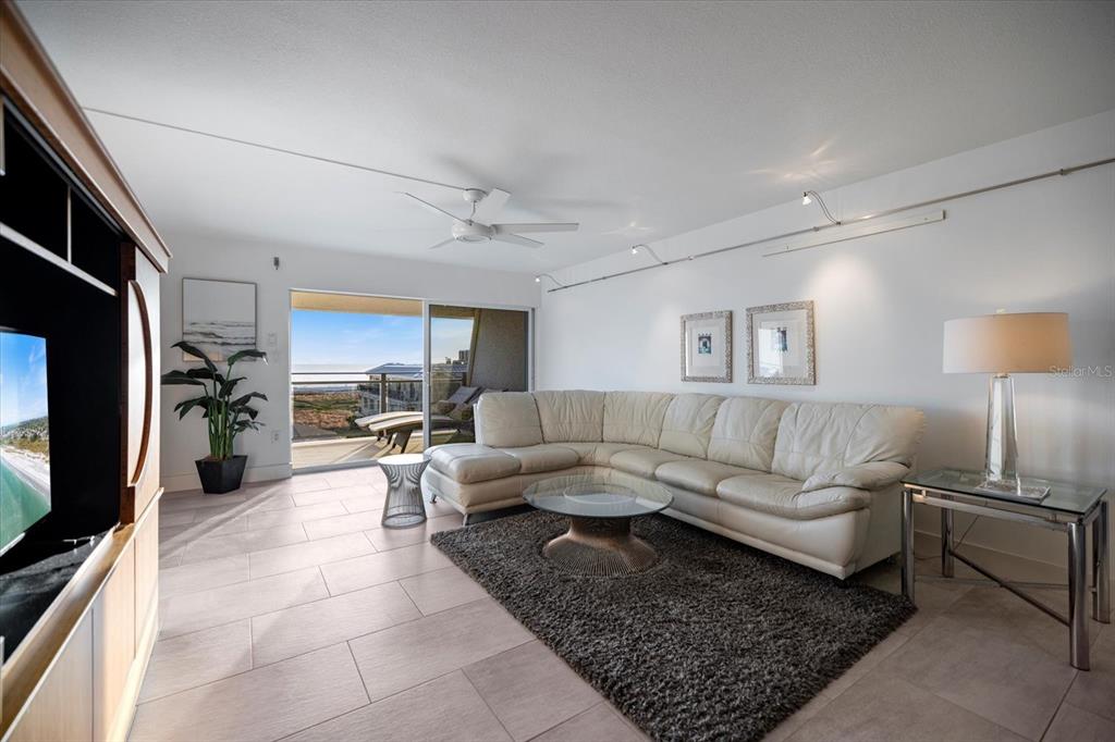 625 Beach Road, Unit 602 Sarasota, FL 34242 - Photo 19 of 65 a living room with furniture and a flat screen tv