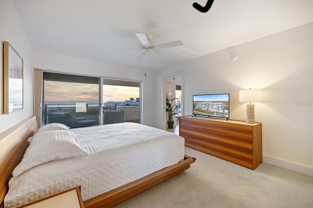 625 Beach Road, Unit 602 Sarasota, FL 34242 - Photo 26 of 65 a bedroom with a bed and large window