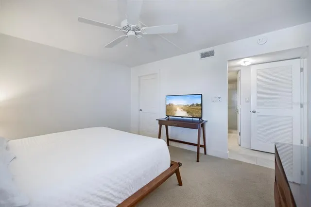 a living room with lots of furniture and a large window