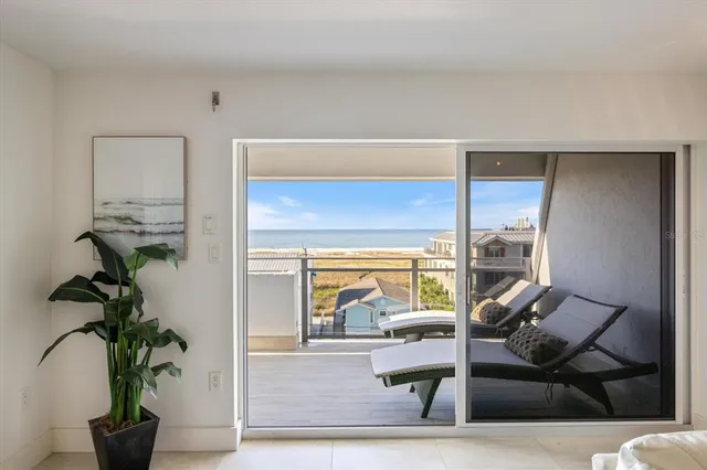a view of a dry yard with mountains in the background