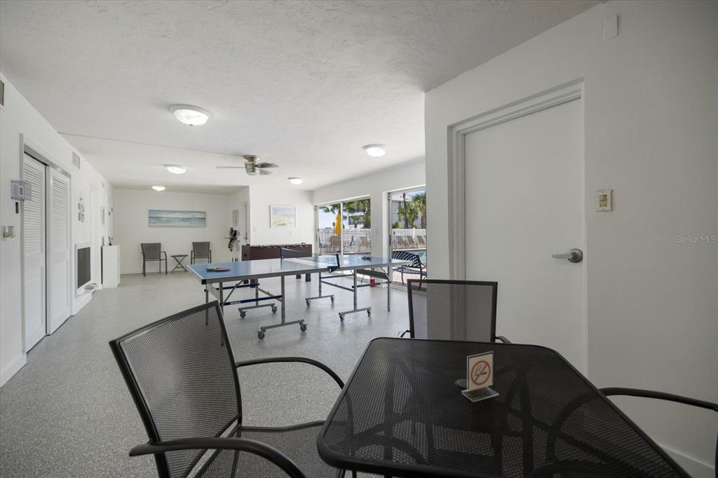 625 Beach Road, Unit 602 Sarasota, FL 34242 - Photo 50 of 65 a view of a dining room with furniture and wooden floor