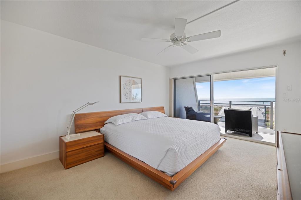 625 Beach Road, Unit 602 Sarasota, FL 34242 - Photo 5 of 65 a bedroom with a bed and a fireplace