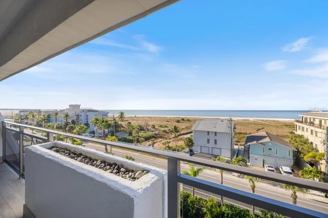 a kitchen with stainless steel appliances granite countertop a refrigerator and a stove